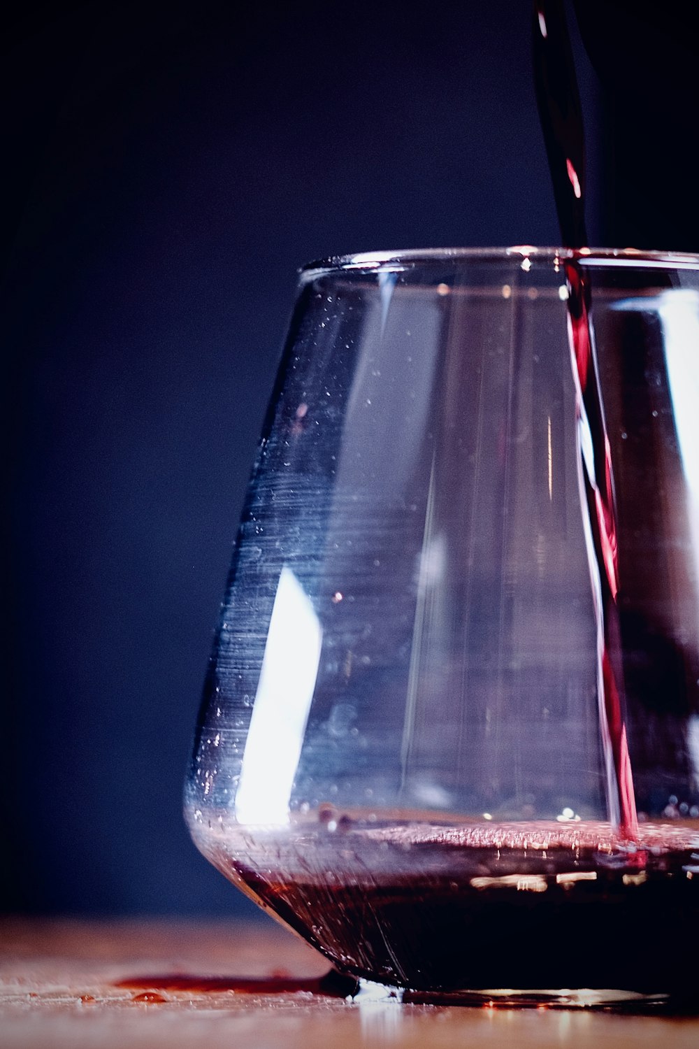 clear drinking glass with red liquid