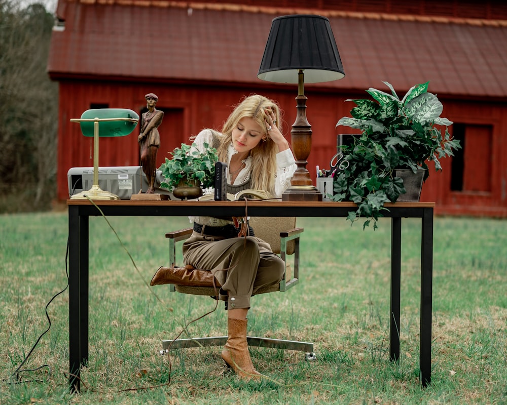 woman in brown leather jacket sitting on brown wooden chair