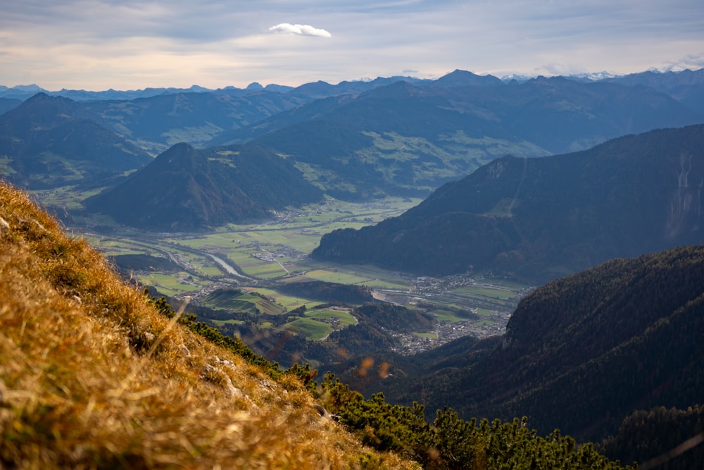 green mountains under white clouds during daytime