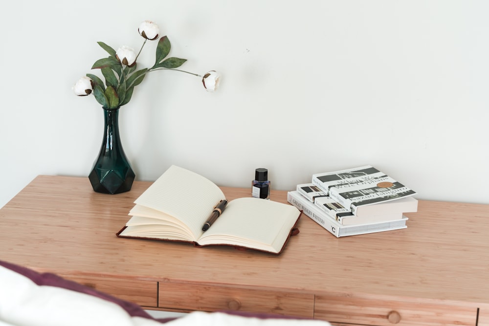 white book on brown wooden table