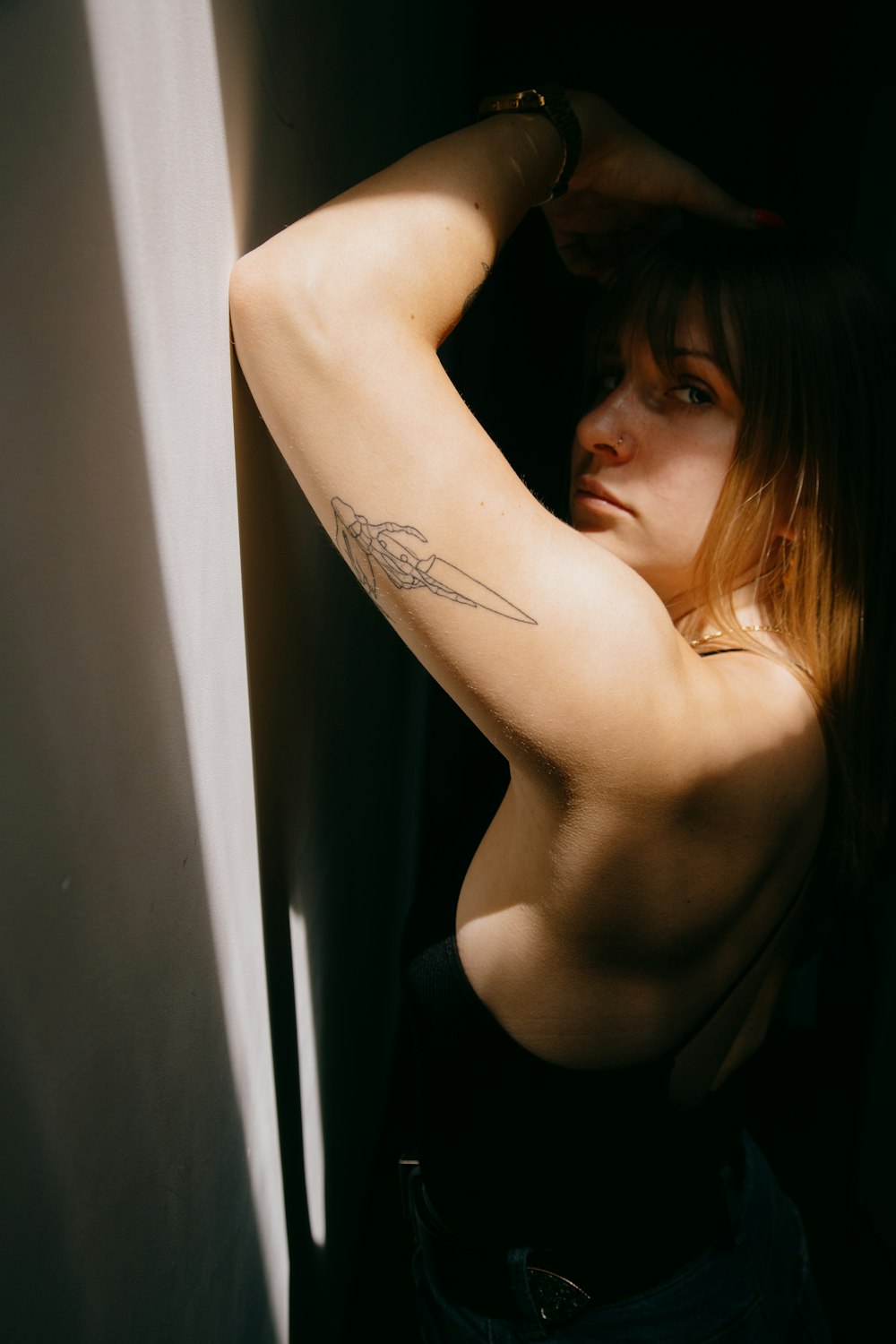 Woman in black tank top with tattoo on her back photo – Free Belgium Image  on Unsplash