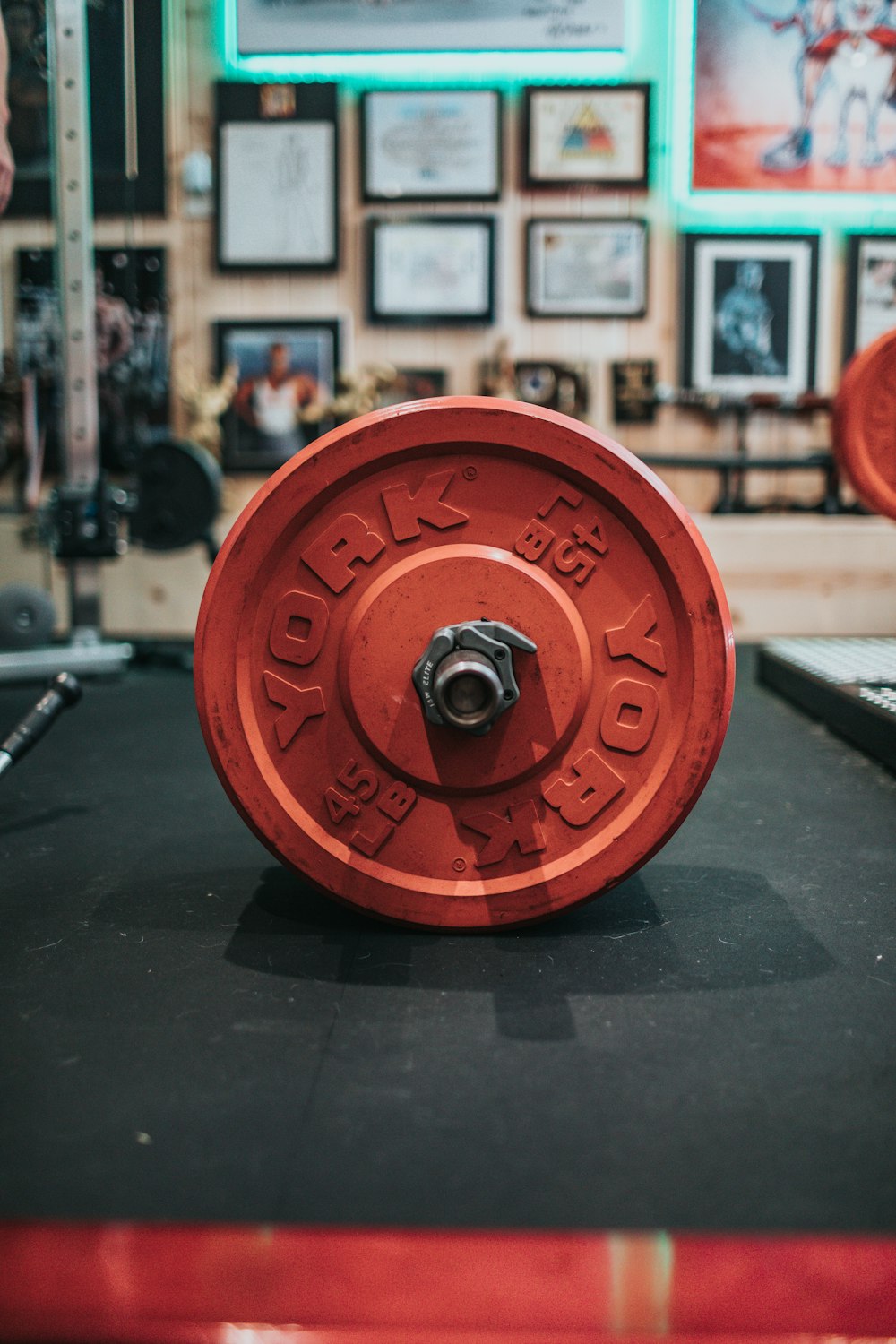 red round dumbbell on black table