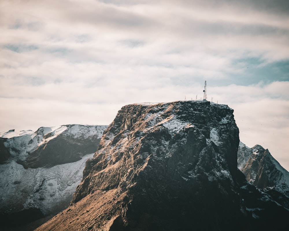 person standing on rock formation during daytime