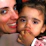 Smiling mother holding her happy child after a dental appointment