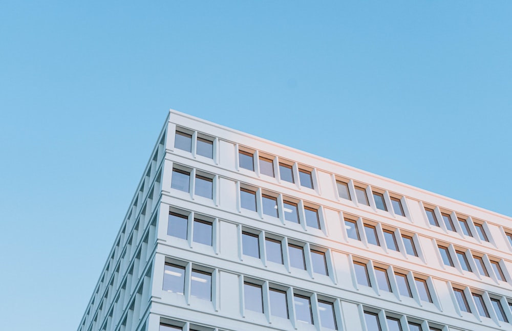 white concrete building under blue sky during daytime