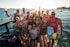 group of people standing on beach during daytime