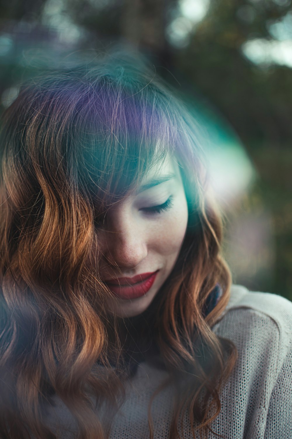 woman in gray turtleneck sweater