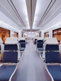 Close-up of geee rail’s modern train interior featuring comfortable seating and large panoramic windows.