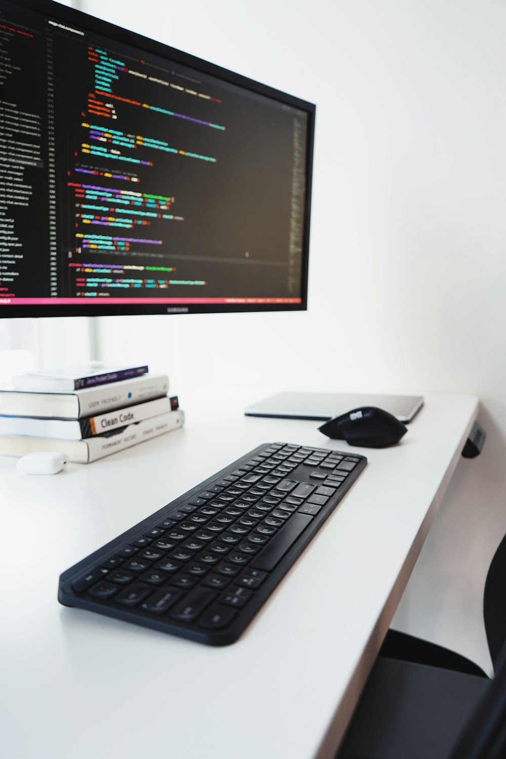 black computer keyboard on white desk