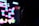 A silhouette of a person is seen in front of a brightly colored, pixelated screen. The screen displays a retro-style video game with vibrant geometric shapes in neon pinks, blues, and yellows. The background is dark, highlighting the contrast between the dark silhouette and the luminous screen.