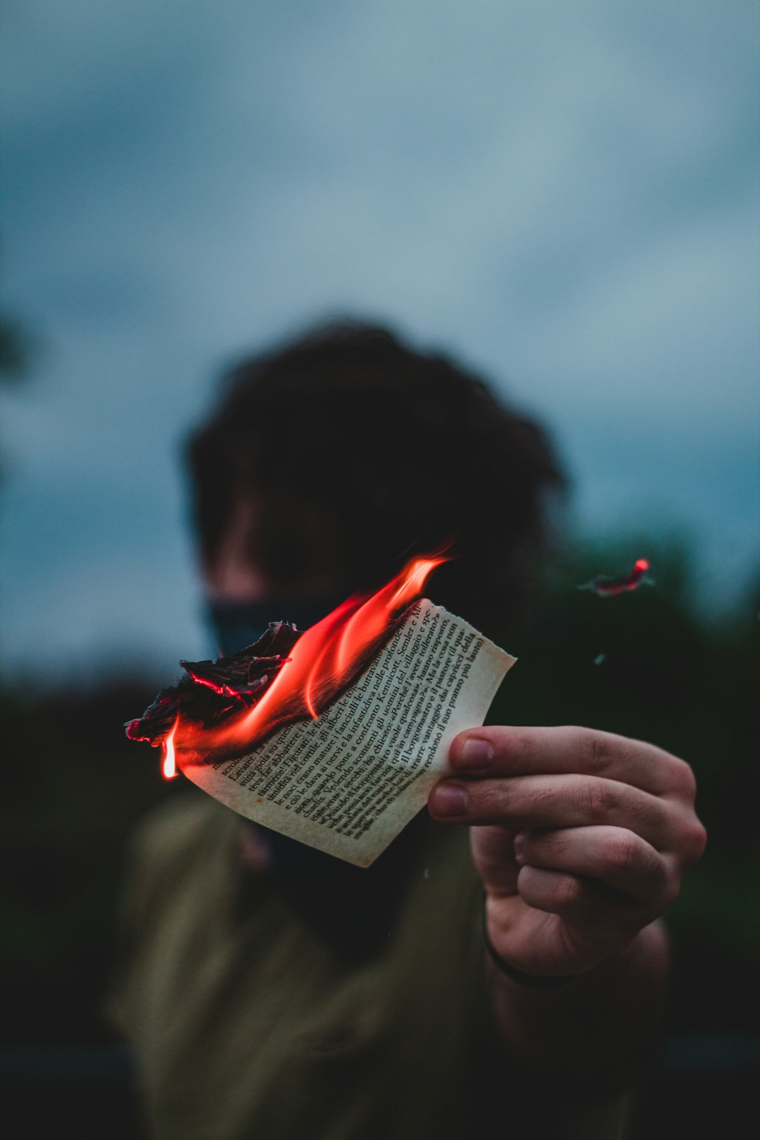 woman holding white book during night time