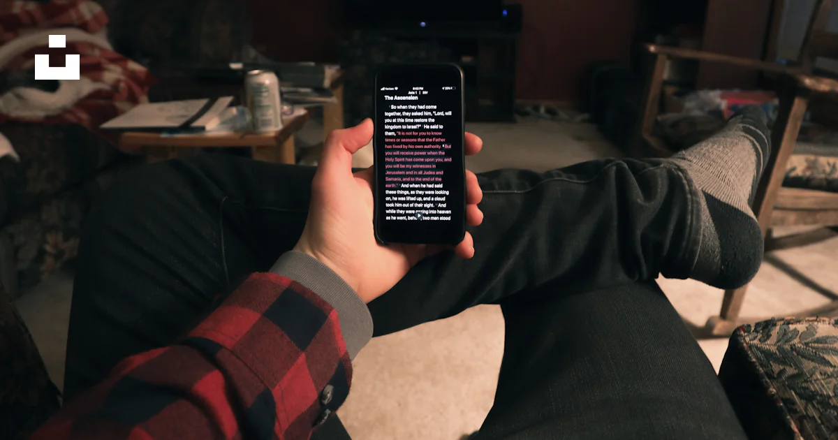 persons holding a red and black remote controllers ·... Person holding black remote control photo – Free Cell phone Image on ...