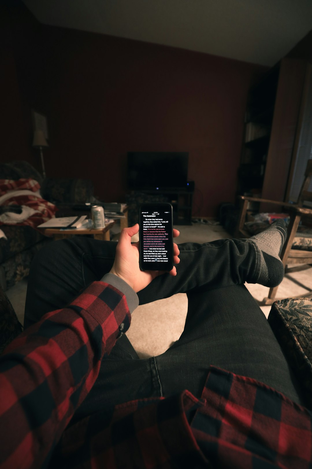 person holding black remote control