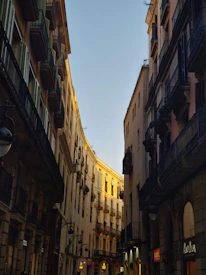 Sunlight filtering through the narrow streets of Cunziria, showing restored facades.