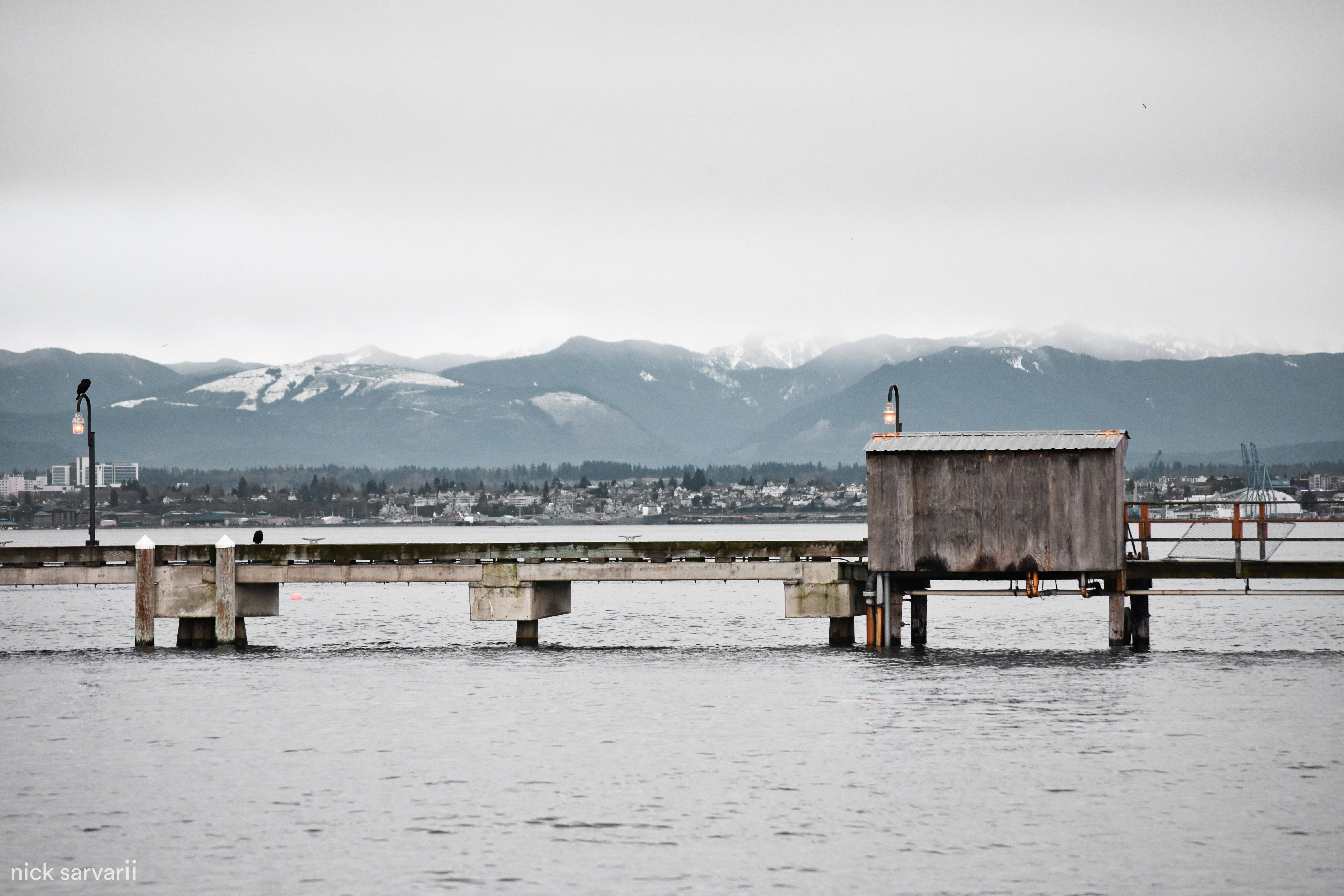 Pier in Mukilteo, Seattle With Snowy Mountains.