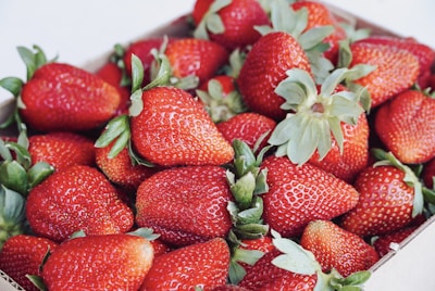 strawberries on white ceramic plate