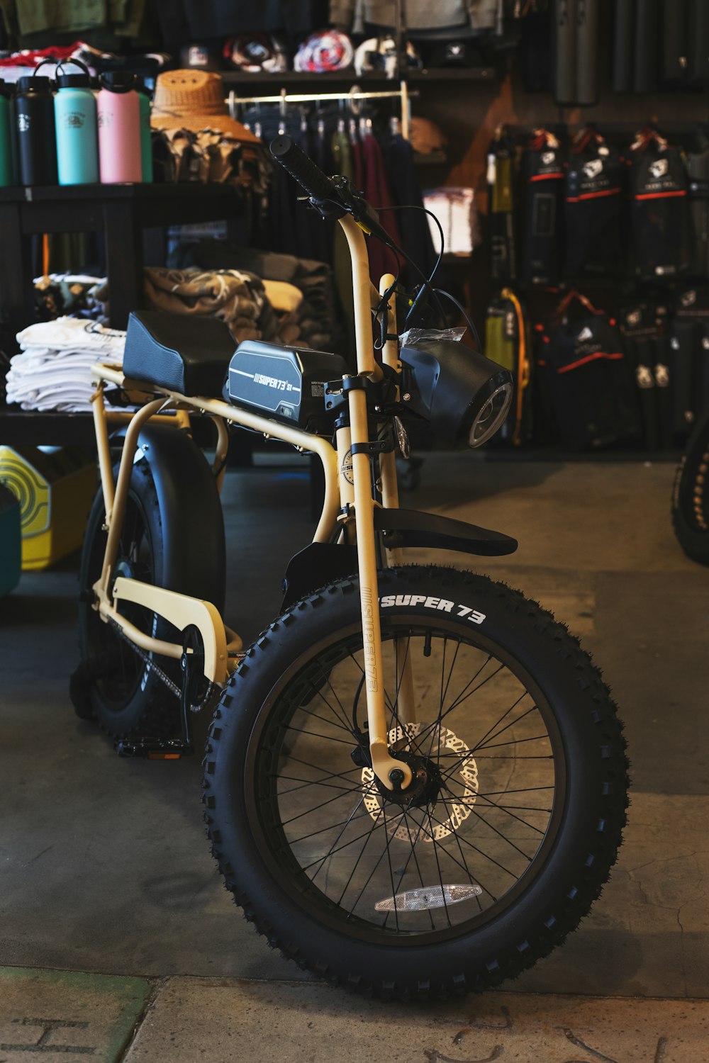 black and yellow bicycle with training wheels