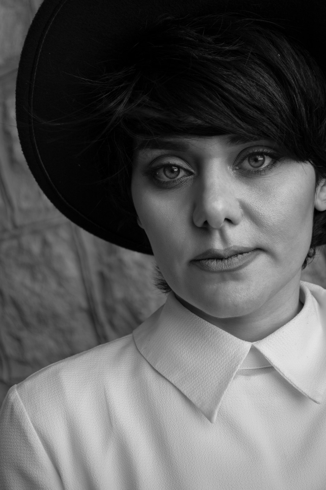 grayscale photo of woman in white collared shirt