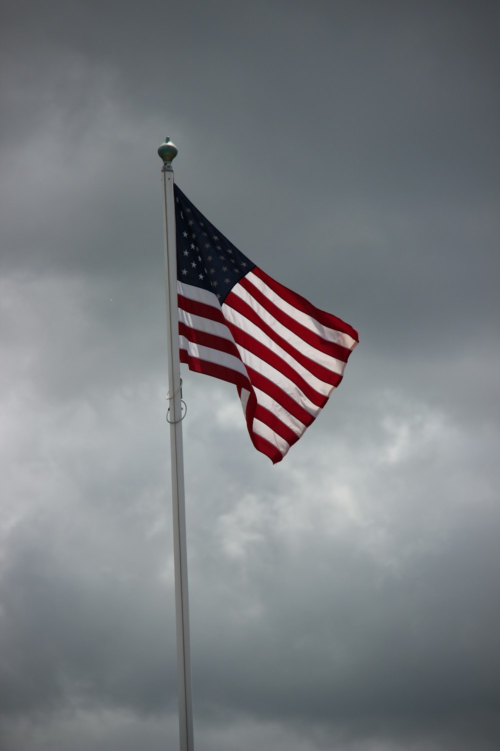 us a flag under cloudy sky