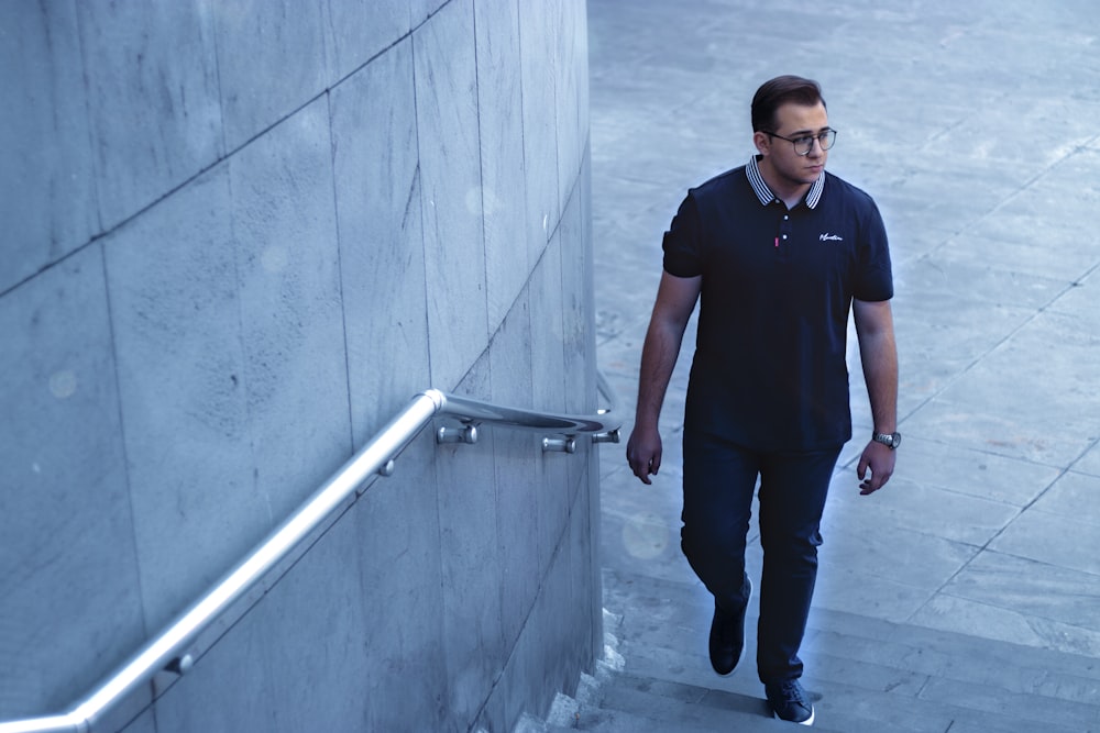 a man walking down a flight of stairs