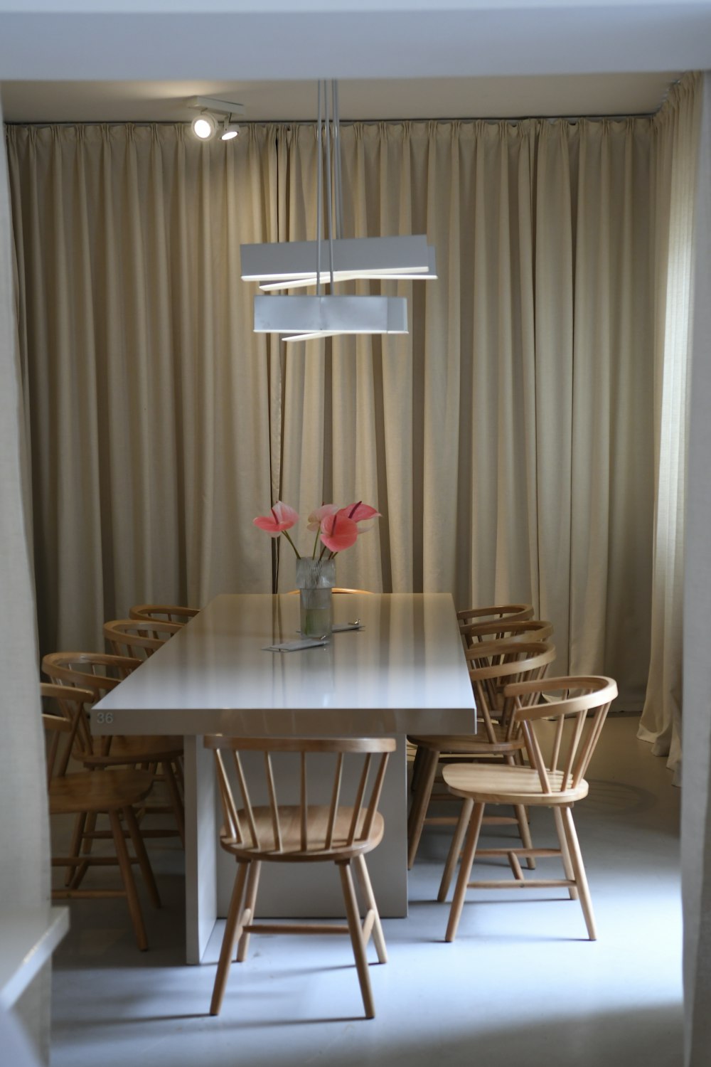 clear glass vase on brown wooden table