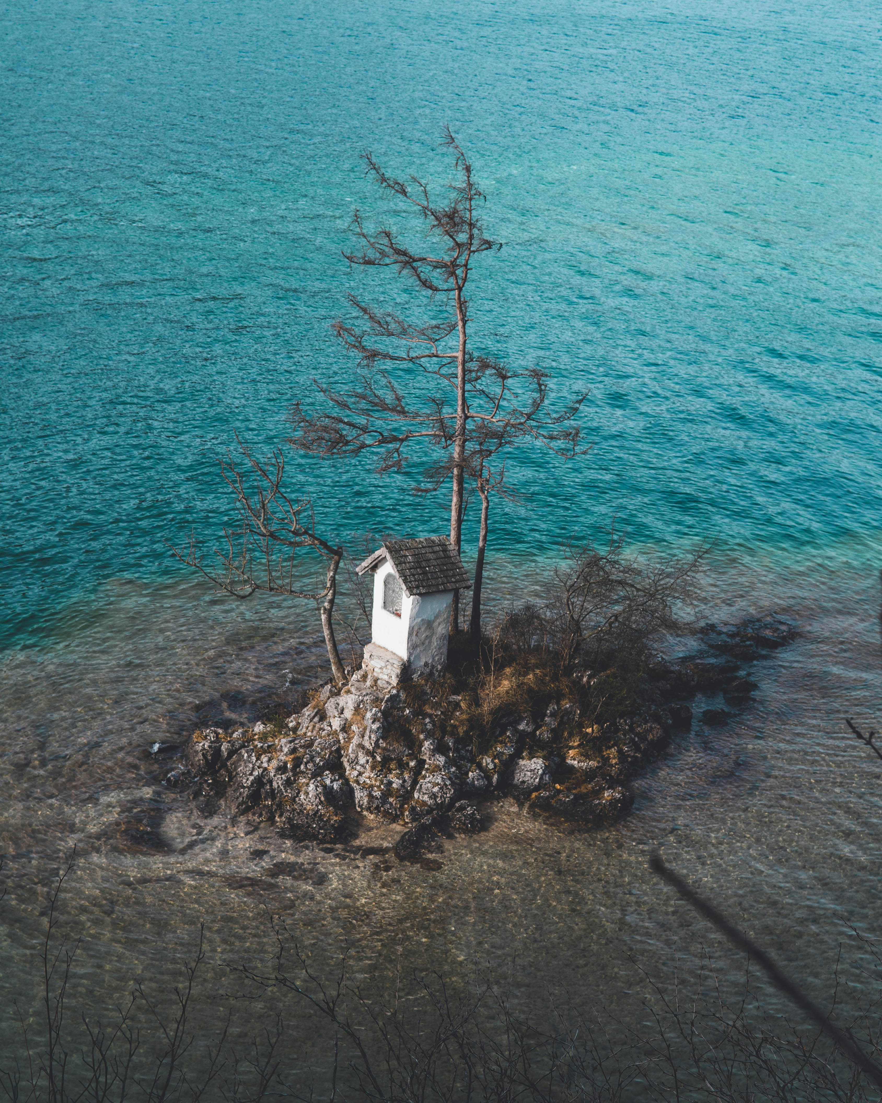 White and brown house near body of water during daytime photo – Free ...