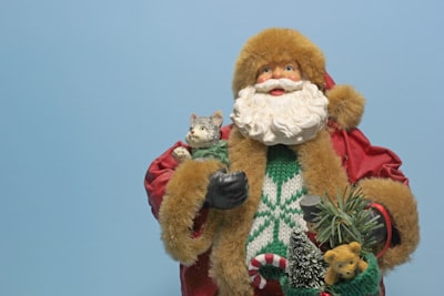 brown bear plush toy on green and white textile kris kringle zoom background
