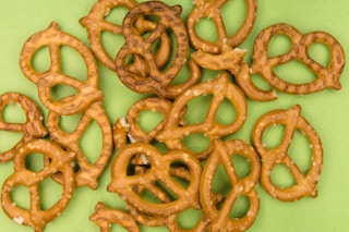 brown cookies on white and green floral ceramic plate