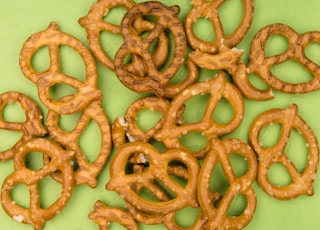 brown cookies on white and green floral ceramic plate