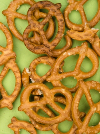 brown cookies on white and green floral ceramic plate