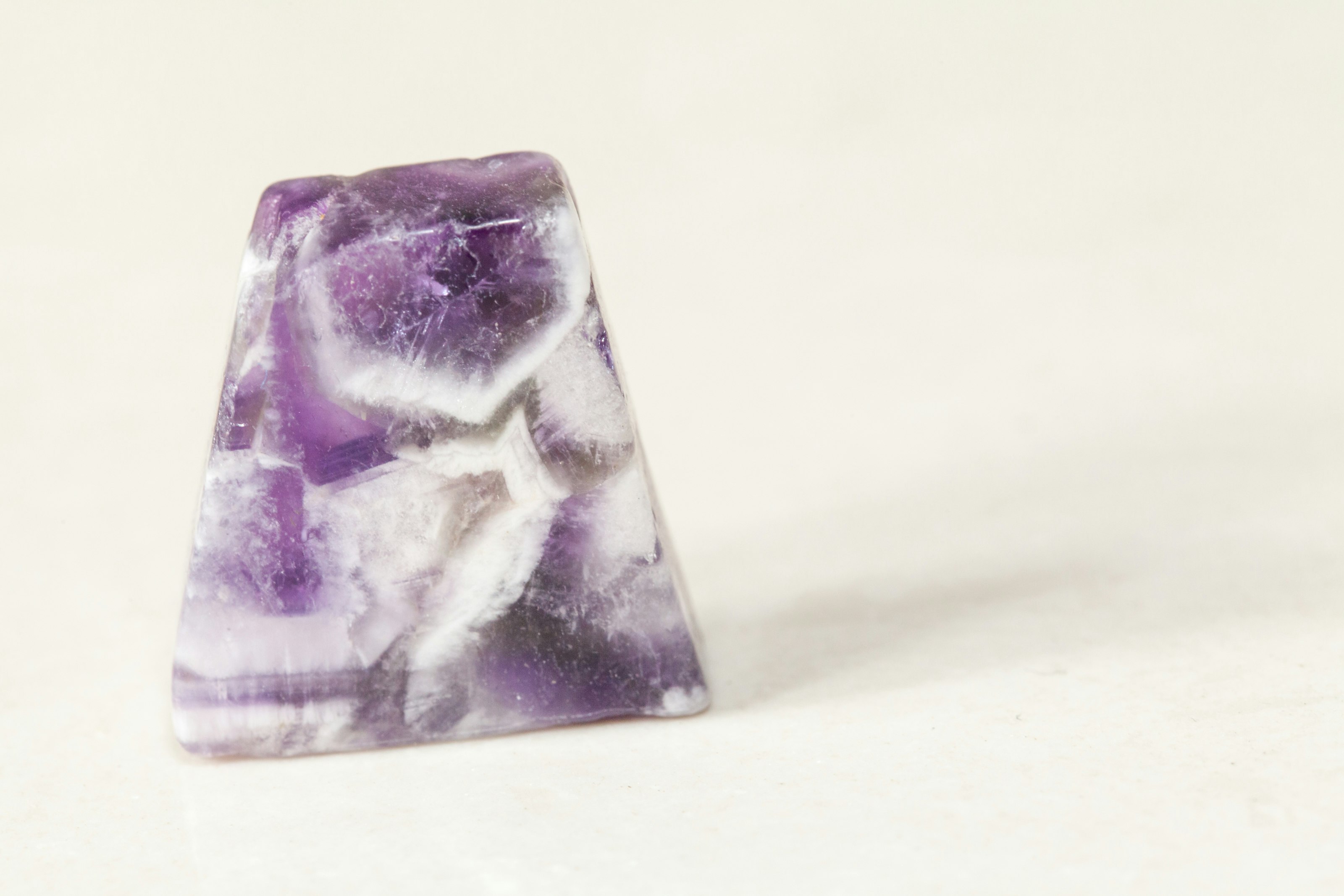 purple and white stone fragment
