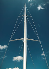 white metal pole under blue sky