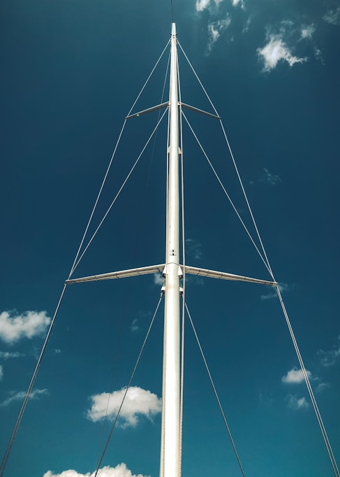 white metal pole under blue sky