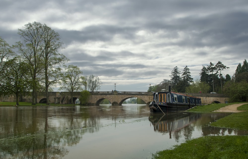 brown wooden bridge over river