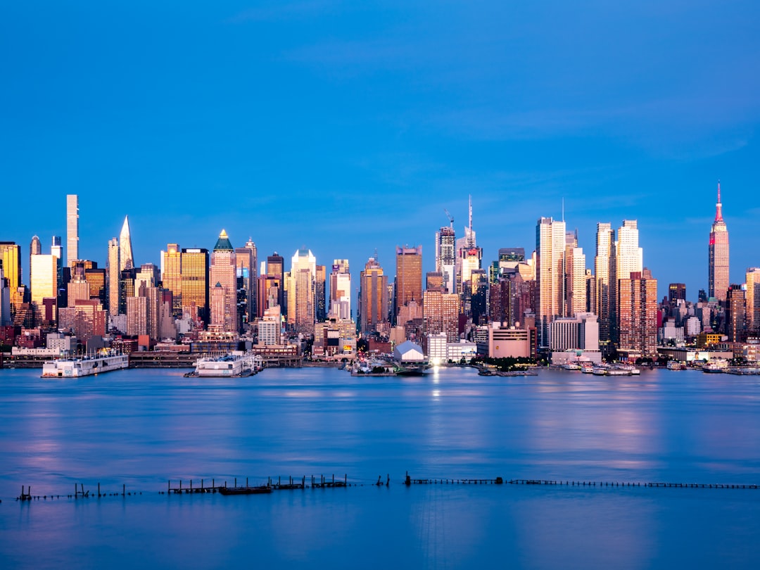 city skyline across body of water during daytime