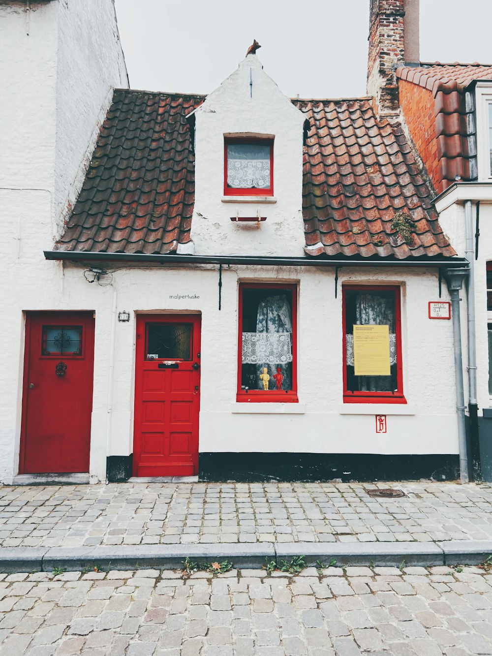 red white and brown wooden doors