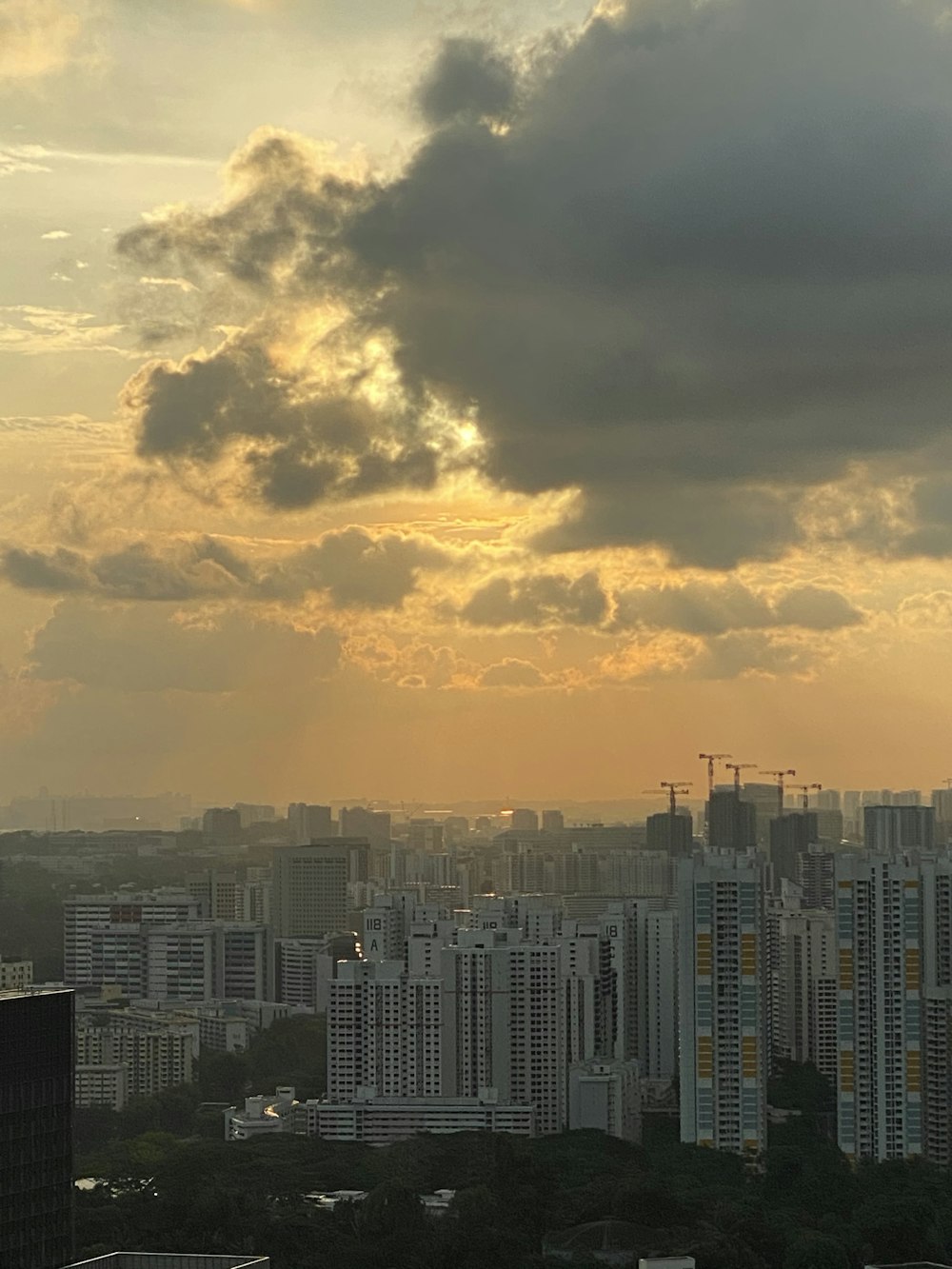 city buildings under cloudy sky during sunset