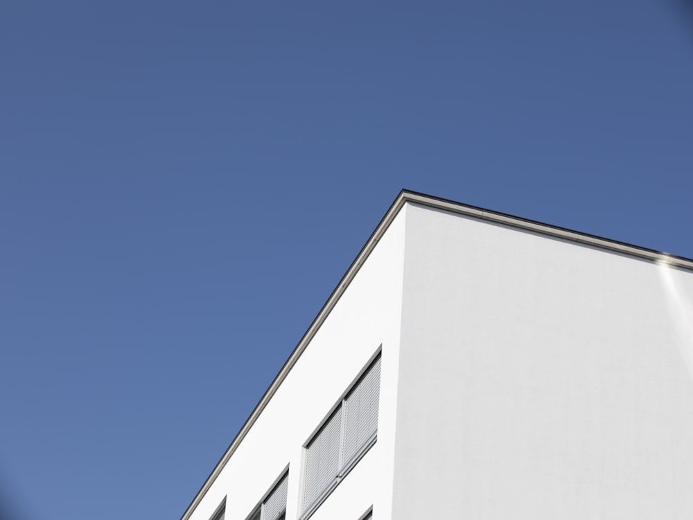 white concrete building under blue sky during daytime