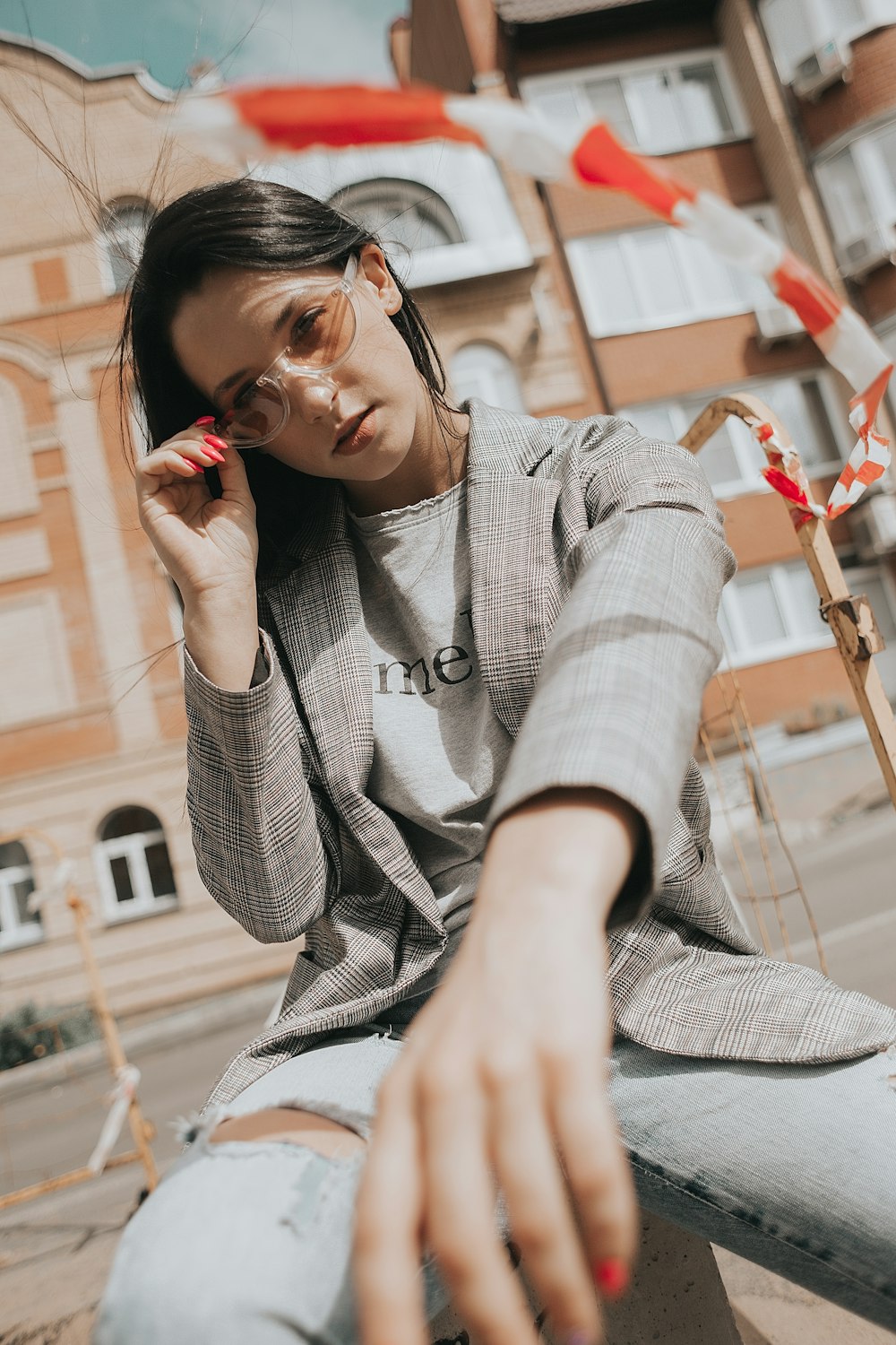 woman in gray cardigan sitting on chair