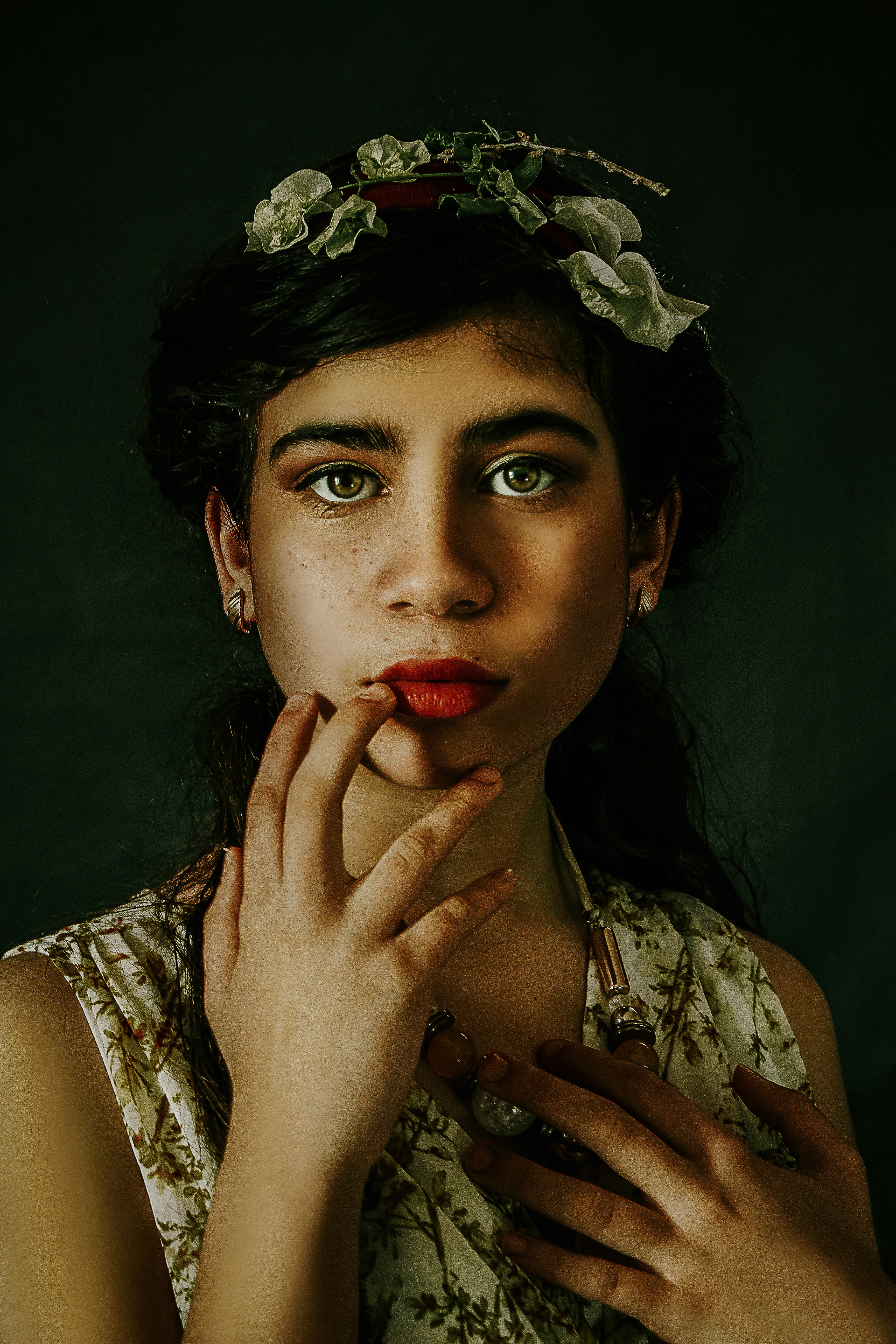 woman in white lace tank top holding red rose
