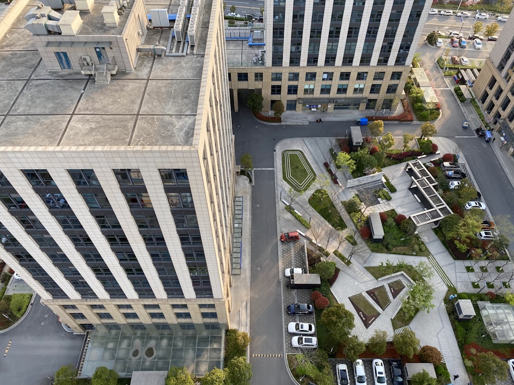 aerial view of cars parked beside building during daytime