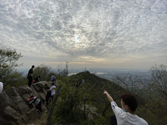 A group of people gathered outdoors, sharing stories under a cloudy sky typical of southern Chile.