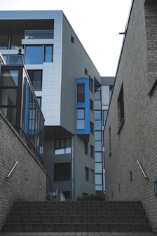 gray concrete building with blue windows