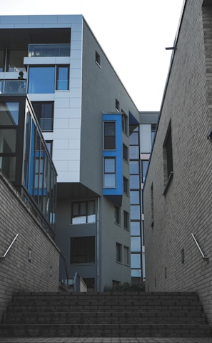 gray concrete building with blue windows