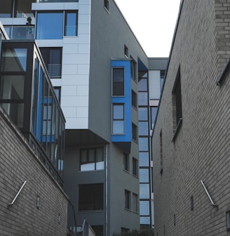 gray concrete building with blue windows