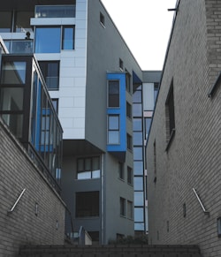 gray concrete building with blue windows