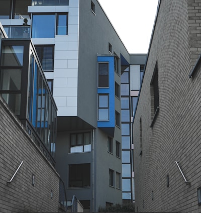 gray concrete building with blue windows