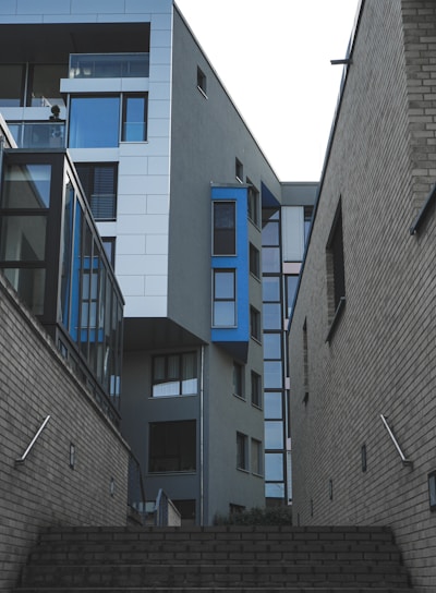 gray concrete building with blue windows