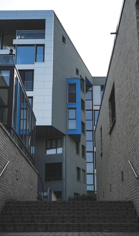 gray concrete building with blue windows