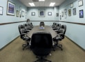 black office rolling chairs on brown carpet